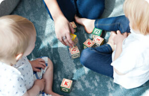 kids playing on the floor with blocks