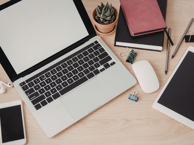 laptop and home workspace setup to create an ai digital product
