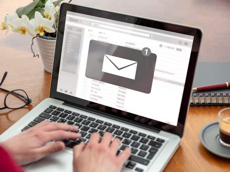image of laptop with email pulled up; how to sell digital products by email marketing